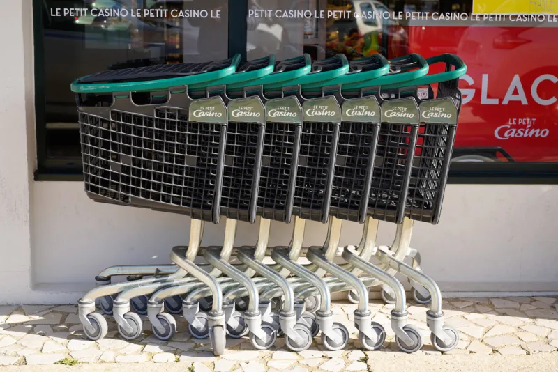 bordeaux , aquitaine   france - 02 15 2020   le petit casino supermarket plastic steel trolleys collected front store market shop