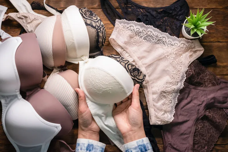 woman is choosing a new underwear in a lingerie shop