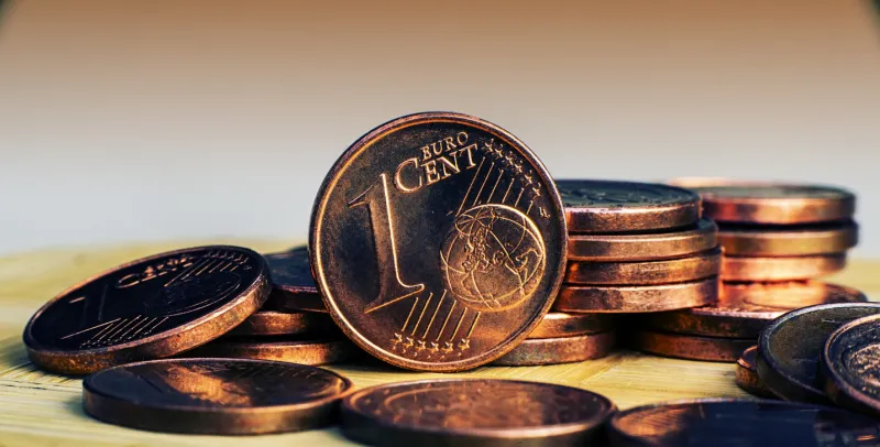 one eurocent coin on the background of coins panoramic and web banner format