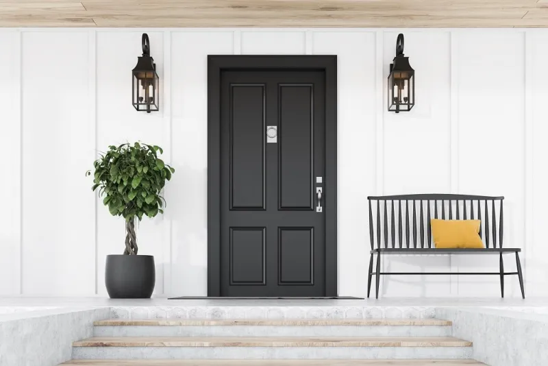 stylish black front door of modern house with white walls, door mat, tree in pot, black bench, stairs and lamps 3d rendering