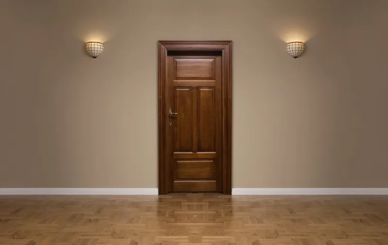 closed wooden door in the empty room with copy space