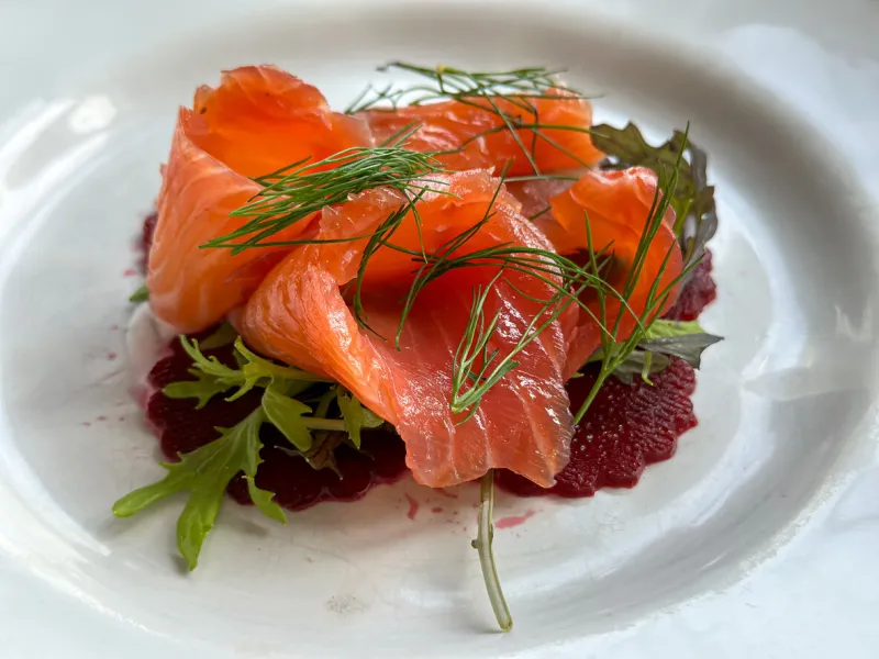 scandinavian meal with red fish (gravadlax , graavilohi) trout gravlax with beet slices and served with dill