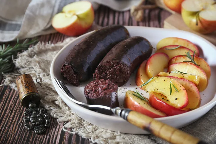 traditional french cuisine  fried blood sausage and apples