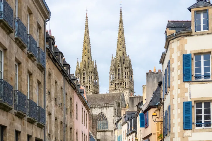 quimper in brittany, the saint-corentin cathedral in a beautiful medieval street
