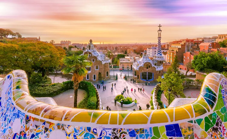 view of the city from park guell in barcelona, spain with moving clouds