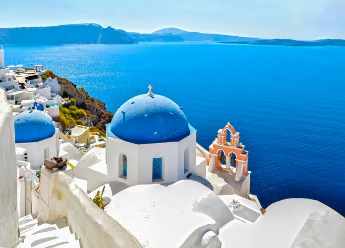 traditional greek church over the blue sea of ​​the aegean sea