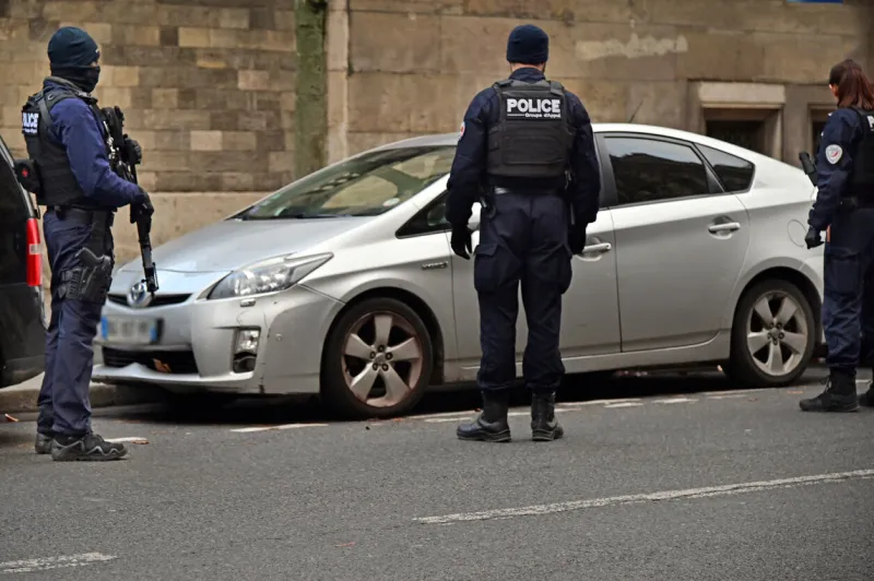paris - nov 30 2022 armed national police offices arresting a suspect in paris, francethe national police is france main civil law enforcement agency, with primary jurisdiction in cities and large towns