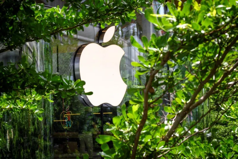 the apple logo is pictured outside the newly-opened apple store in downtown bangkok on july 31, 2020 (photo by mladen antonov   afp)