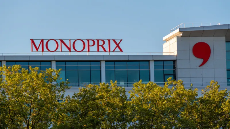 clichy, france - august 20, 2023  sign and logo on the building housing the headquarters of the french company monoprix the monoprix stores retail food as well as fashion, beauty and home products