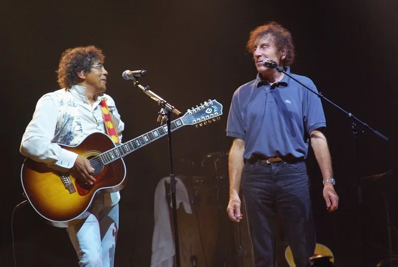 alain souchon and laurent voulzy perform together on the stage of olympia - paris