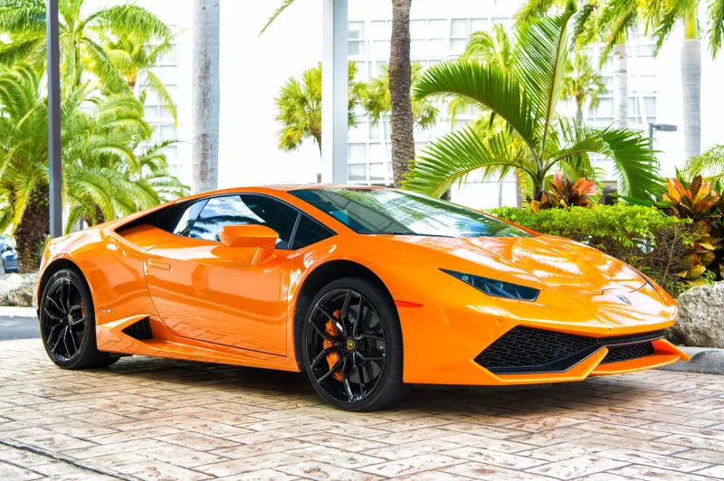 miami, florida, united states - february 19, 2016  supercar lamborghini aventador orange color parked next to ocean drive at south bech at miami, florida lamborghini is famous expensive automobile brand car