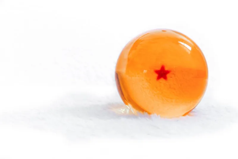 closeup crystal dragon ball yellow with one star on a white background