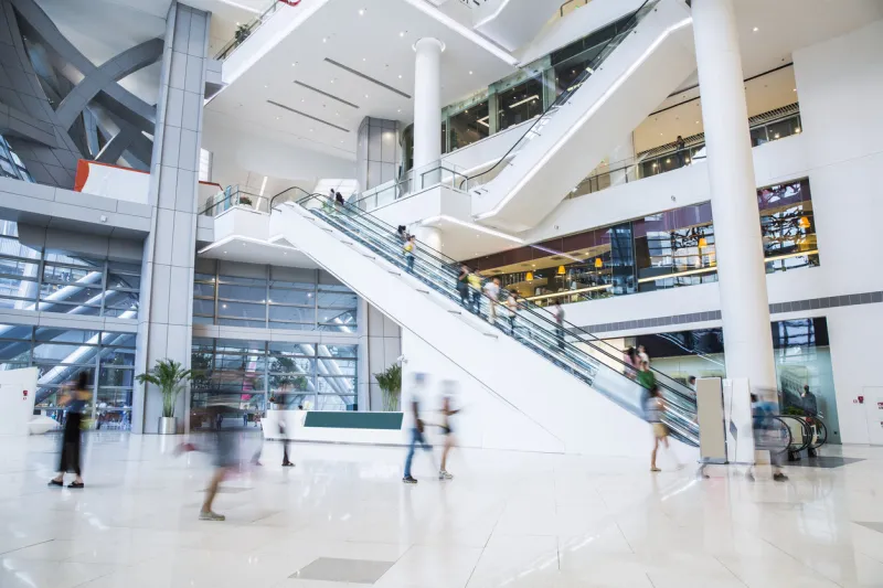 busy shopping mall, long exposure time, shoppers moving are deliberately blurred