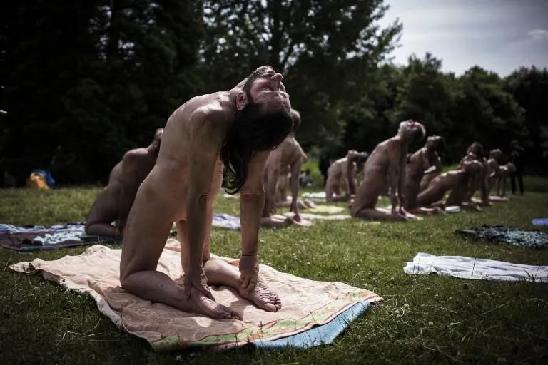 editors note  graphic content   naturists practice yoga in the bois de vincennes on the outskirts of paris on june 24, 2018    afp photo   philippe lopez