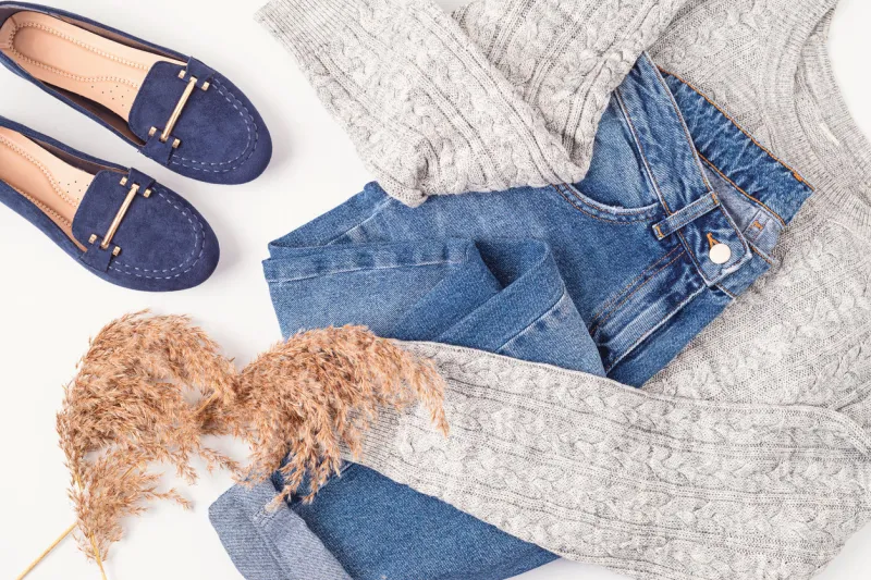 flat lay with comfort warm outfit for cold weather comfortable autumn, winter clothes shopping, sale, style in trendy colors concept