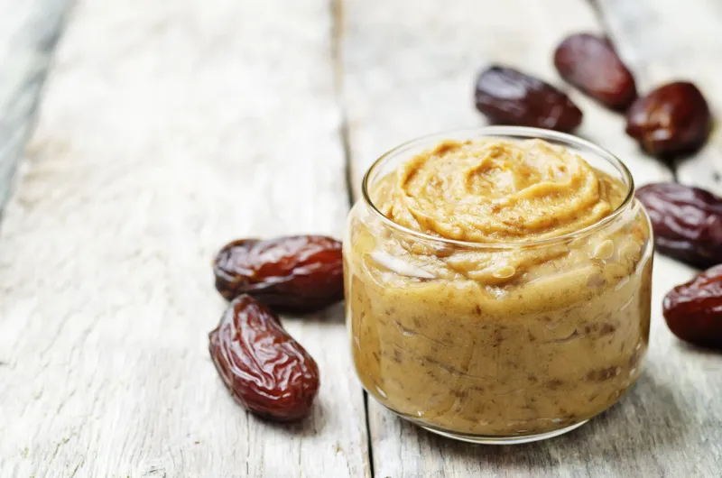 dates pasta on wood background toning selective focus