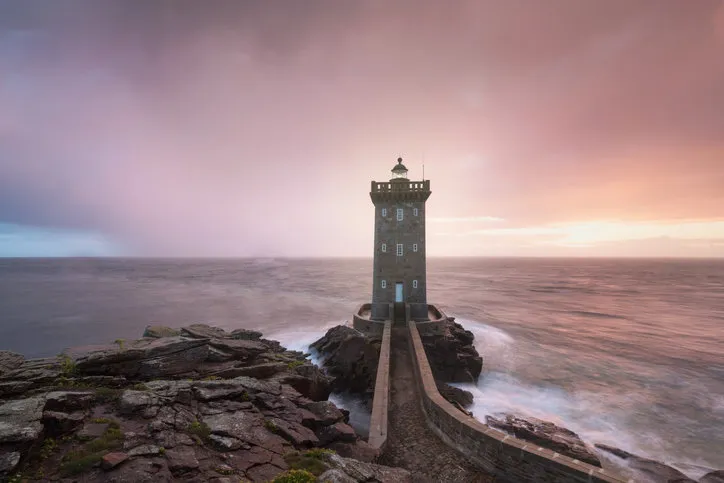 beautiful kermorvan lighthouse, most western part of france, le conquet, bretagne, france stormy weather in coastline