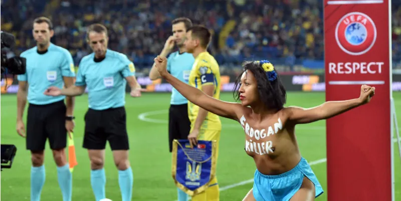 a 'femen' activist with the words erdogan killer written on her chest protests prior to the fifa world cup 2018 qualification football match between ukraine and turkey in kharkiv on september 2, 2017   afp photo   sergei supinsky