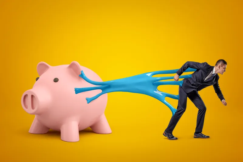 young businessman stuck to pink piggy bank with blue sticky slime on yellow background digital art people and objects money and finance