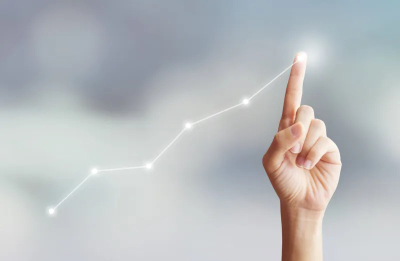 hand touching graph moving up with plan growing