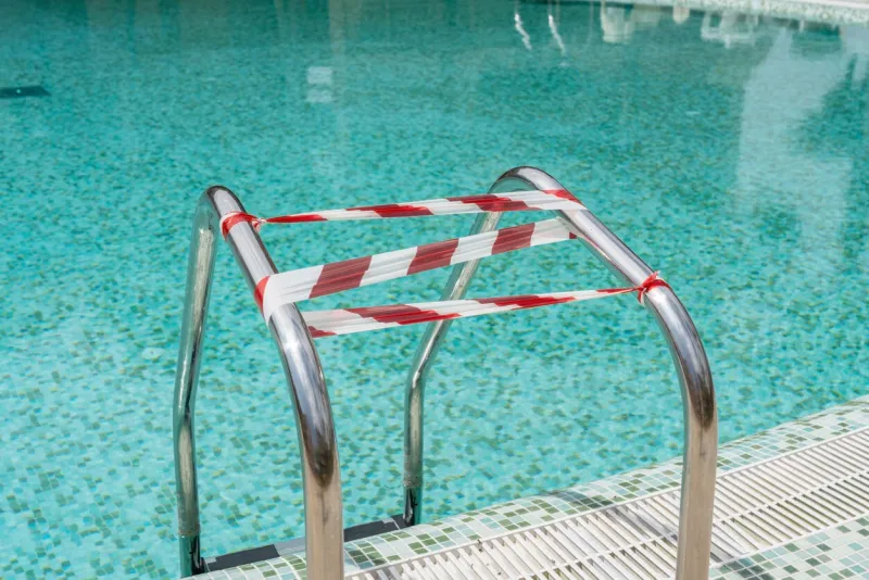 the pool during the coronavirus, wrapped in a tape that prohibits entry into it