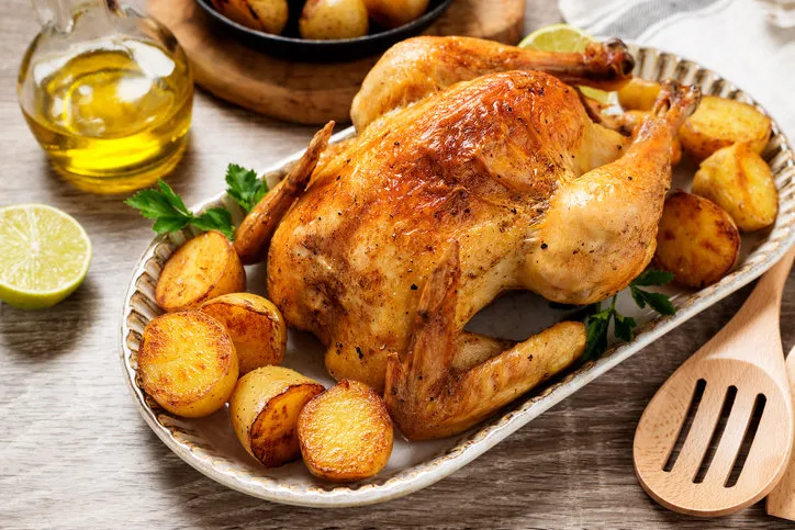 whole roasted chicken with baked potatoes