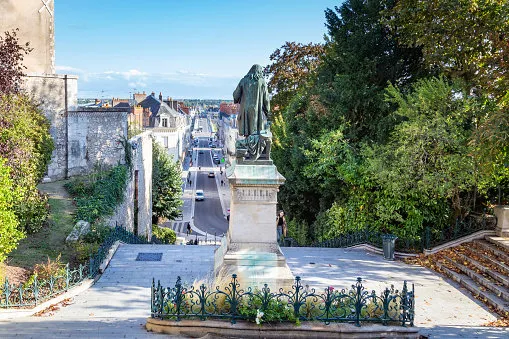 blois, france - october 10, 2019  view from top of escalier denis papin or mona lisa stairway with statue of denis papin