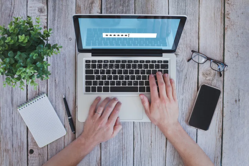 user typing password on computer, security code to access, secured login to bank online