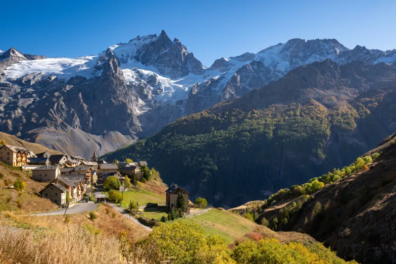 la meije peak in ecrins national park with the village of le chazelet and glacier in autumn hautes-alpes (05), french alps, france