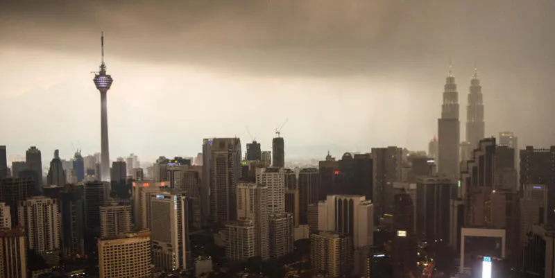 a rainstorm is getting closer and closer to the city of kuala lumpur, malaysia a stunning view of a modern urban environment