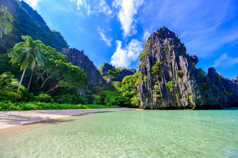 hidden beach in matinloc island, el nido, palawan, philippines - tour c route - paradise lagoon and beach in tropical scenery