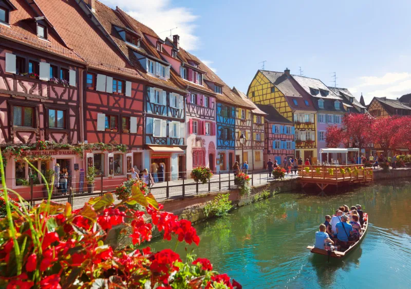 colmar, france - august 21, 2016  people swim in a boat on a river in little venice district in the center of colmar