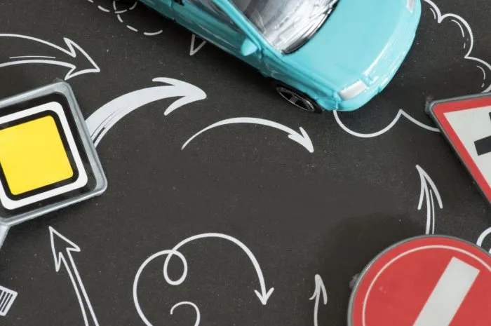 a car and various traffic signs