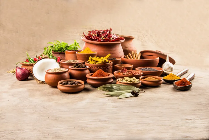 indian spices in terracotta pots, indian colourful spices, group of indian spices, group of spices, india and spices arranged in different size terracotta pots