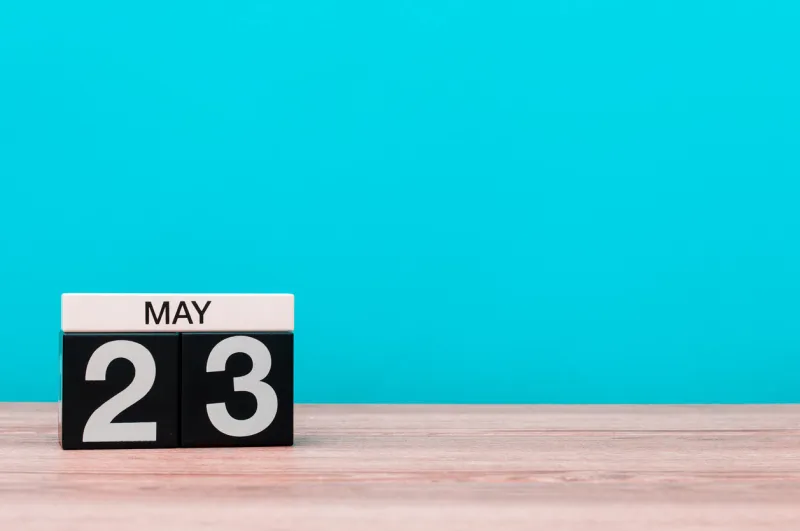 may 23rd day 23 of month, calendar on turquoise background spring time, empty space for text