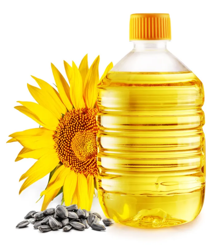 bottle of sunflower oil, sunflower and seeds isolated on white background the most popular of vegetable oils