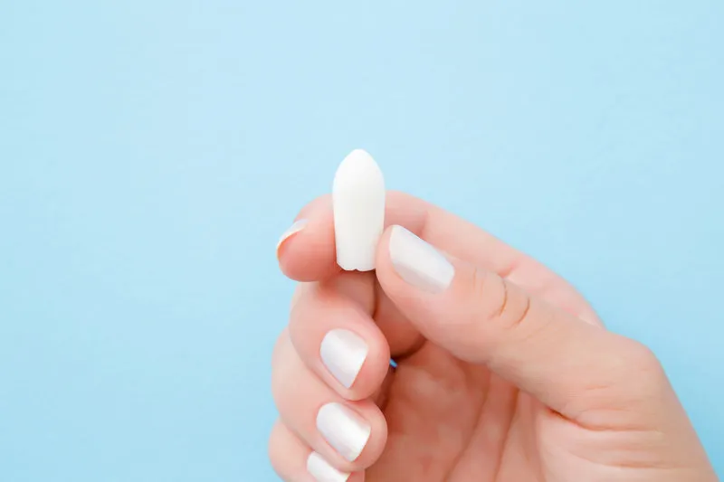 young woman fingers holding white medical candle medical, pharm