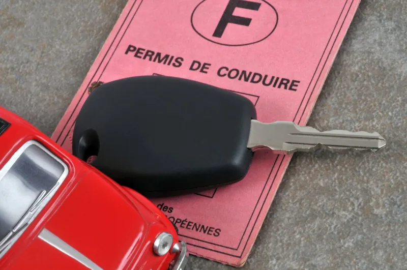 driver's license with a car key
