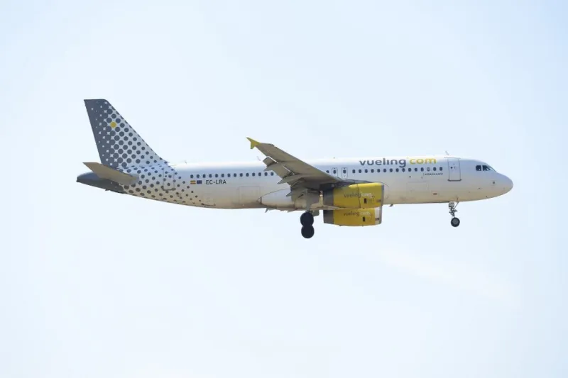an airplane of the spanish low-cost airline vueling prepares to land at barcelona's airport in el prat de llobregat on june 6, 2016 (photo by josep lago   afp)