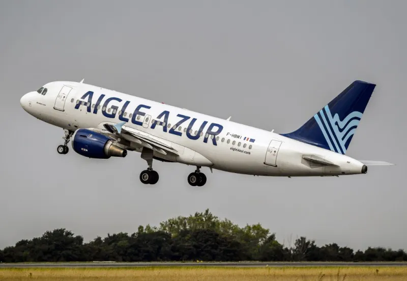 an airbus a319 aircraft of weaving group's french airline aigle azur takes off from lille airport in lesquin, northern france on august 25, 2017 (photo by philippe huguen   afp)