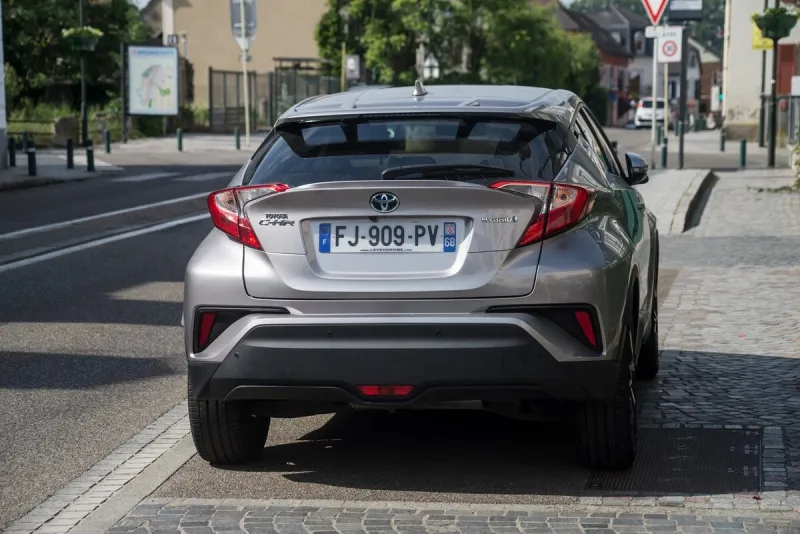 mulhouse - france - 3 june 2022 - rear view of grey toyota c-hr hybrid parked in the street