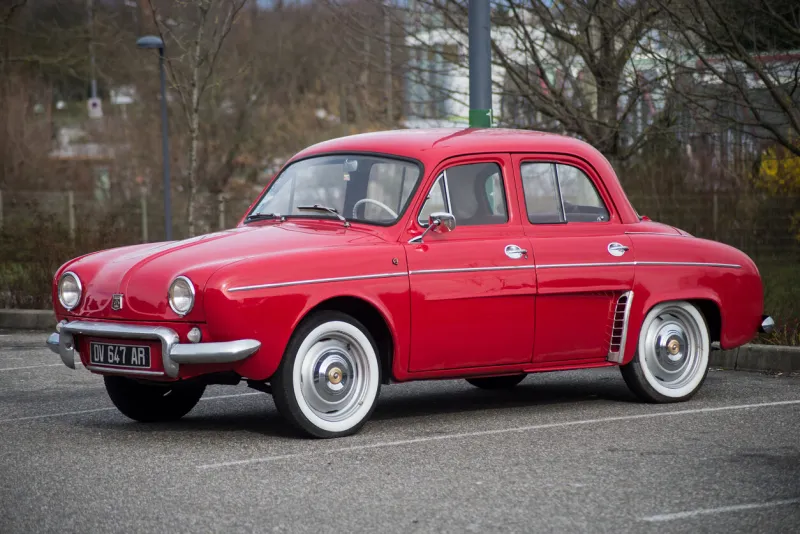 mulhouse - france - 8 mars 2020 - profile view of red renault dauphine vintage parked in the street