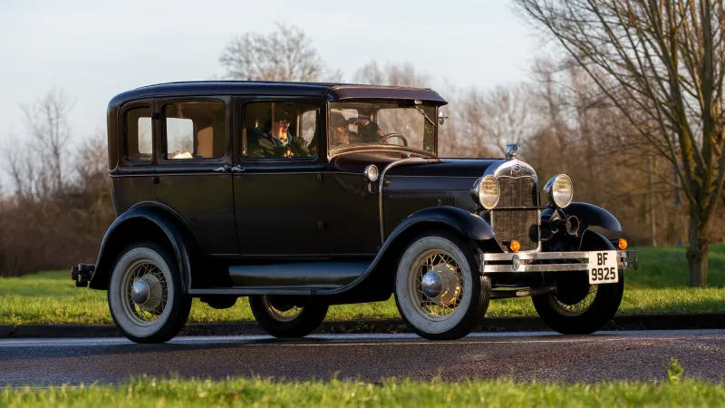 stony stratford, bucks, uk, jan 1st 2023 1929 black vintage ford model a car driving on an english country road