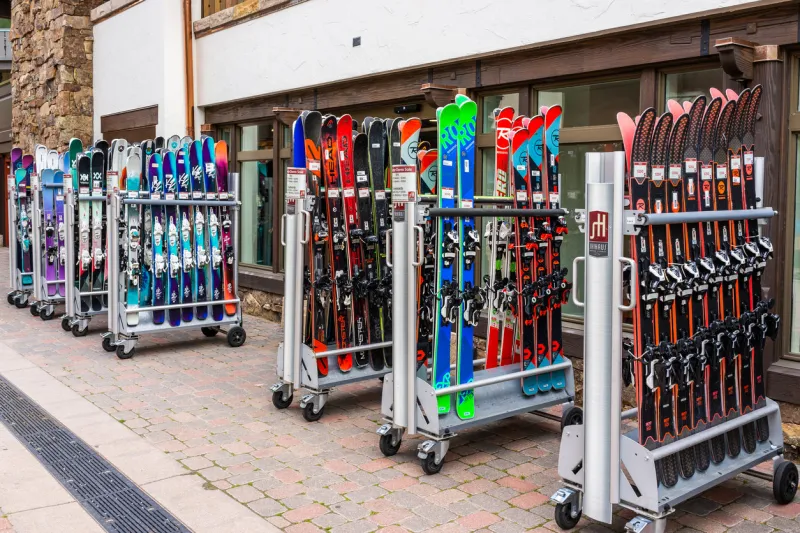 vail, usa - june 29, 2019  vacation town in colorado with store shops and snowboard ski rack