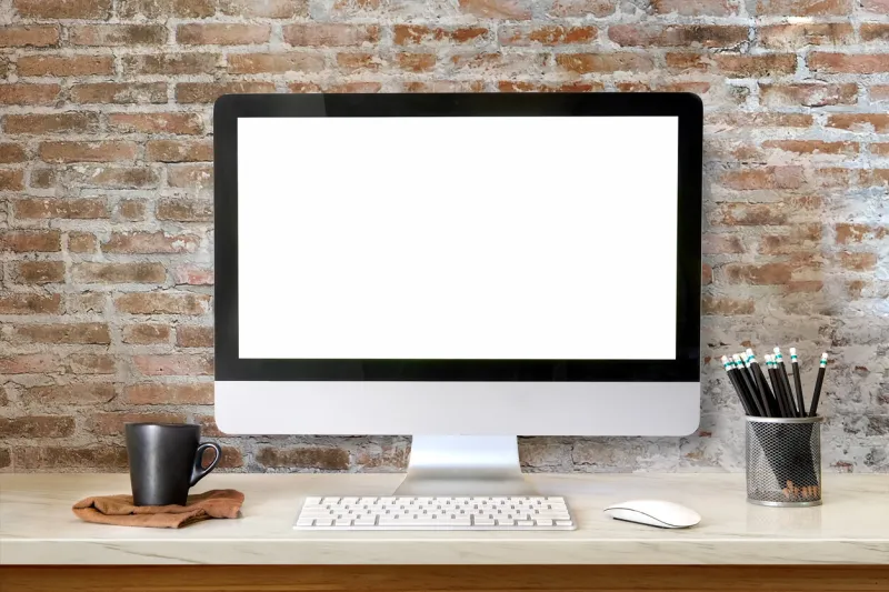 mock up workspace desktop computer   creative designer desktop with blank white desktop computer, pencils and stationery items blank screen for graphics display montage