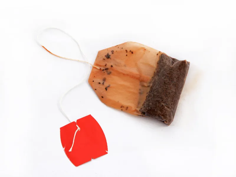 used tea bag on white background
