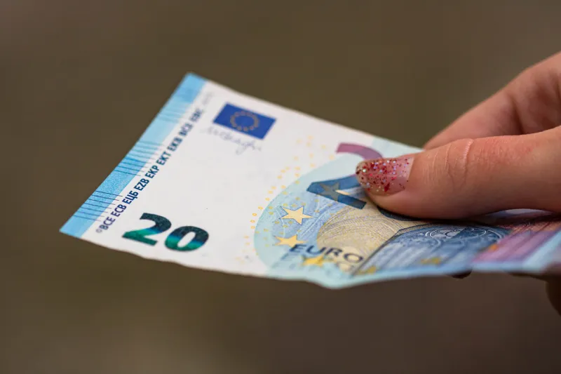 selective focus on detail of euro banknotes counting or giving euro banknotes world money concept, inflation and economy concept