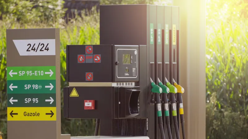 fuel pumps at a gas station, informations signs fuel nozzle in oil dispenser petrol gun filling green and golden colors