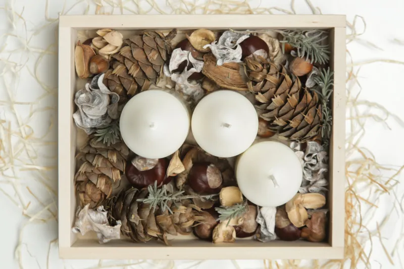 simple and small home decoration with candles in wooden box