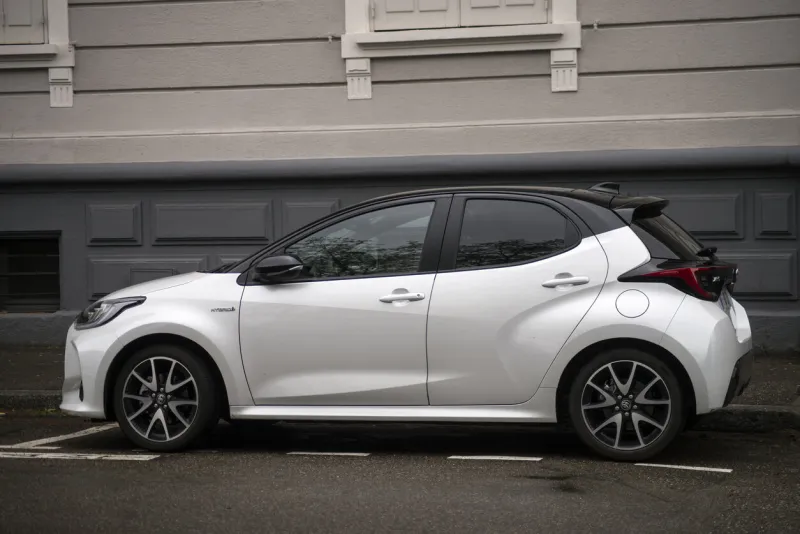 mulhouse - france - 7 may 2021 - profile view of white toyota yaris parked in the street